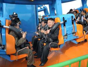 Kim Jong-Un on a roller coaster at, and I'm not joking, The Rungna People's Pleasure Ground.